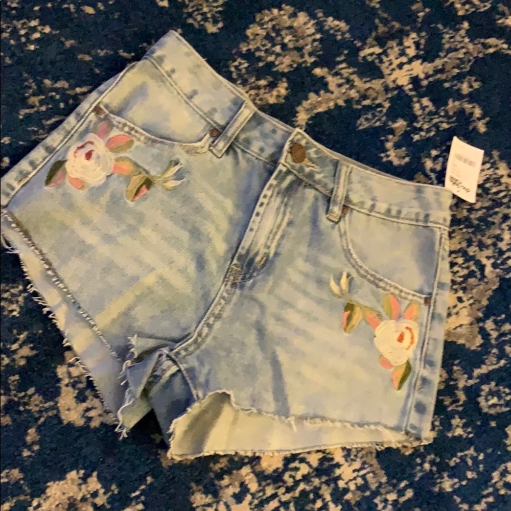 Denim shorts with floral appliqué